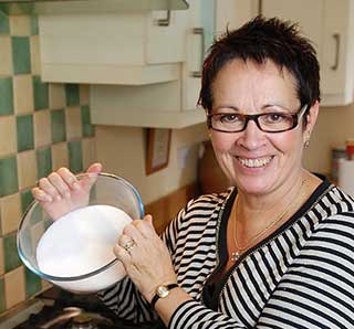 Vivien Lloyd about to add warm sugar to her simmered fruit.