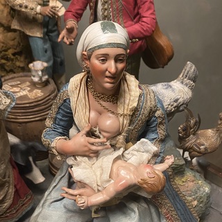 Model of a breastfeeding mother from a preseppio in Naples