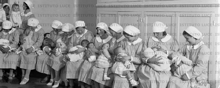 A row of nurses breastfeeding orphans in Rome