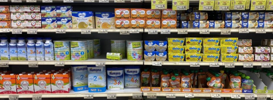 Supermarket shelves showing a bewildering arrays of different types and formats of baby food