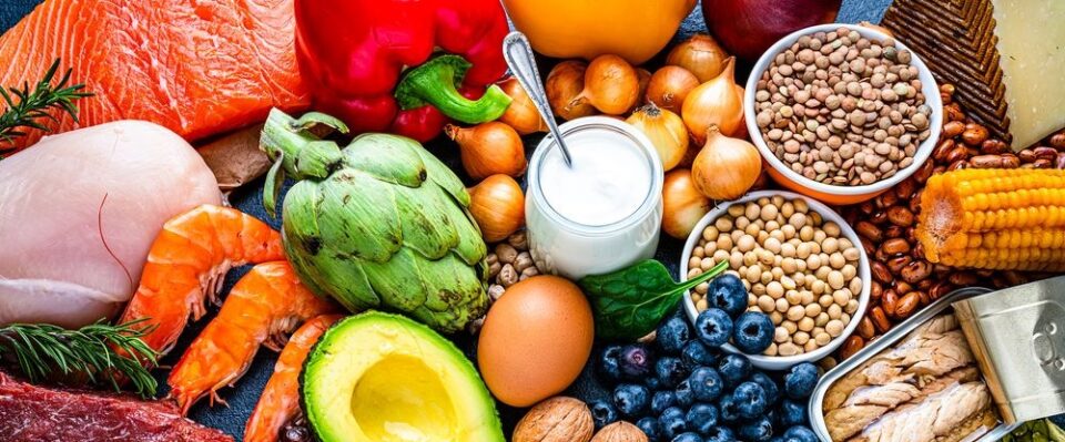 An image of a whole lots of different foods representing the many food groups important for a healthy diet